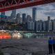 Security officers stand in the dried-out riverbed of the Jialing River in Chonqing on August 20.